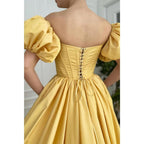 Vestido de fiesta largo de satén amarillo, sin tirantes, con abertura alta y bolsillos, de manga corta 