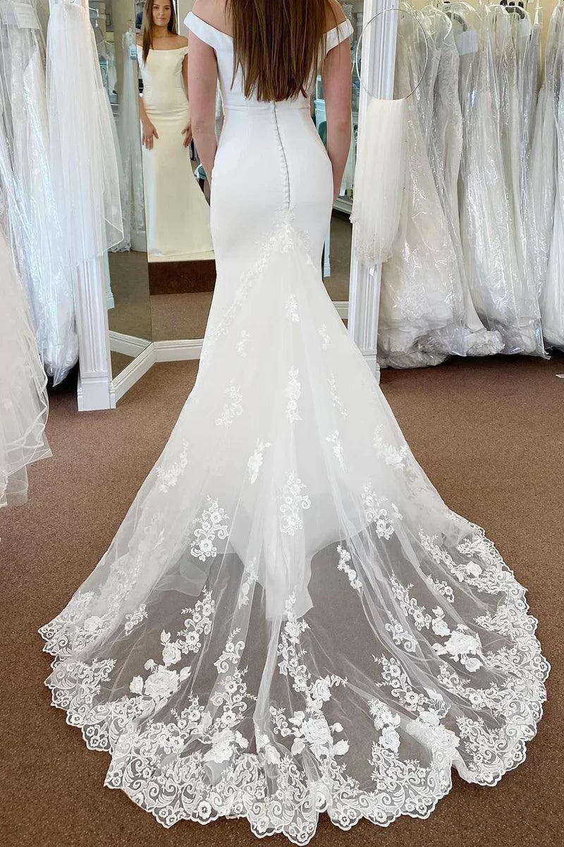 Vestido de novia blanco de corte sirena largo con hombros descubiertos y apliques de encaje