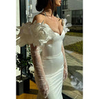Wunderschönes und bezauberndes langärmliges Meerjungfrau-Ballkleid aus trägerlosem Satin mit Blumenmuster