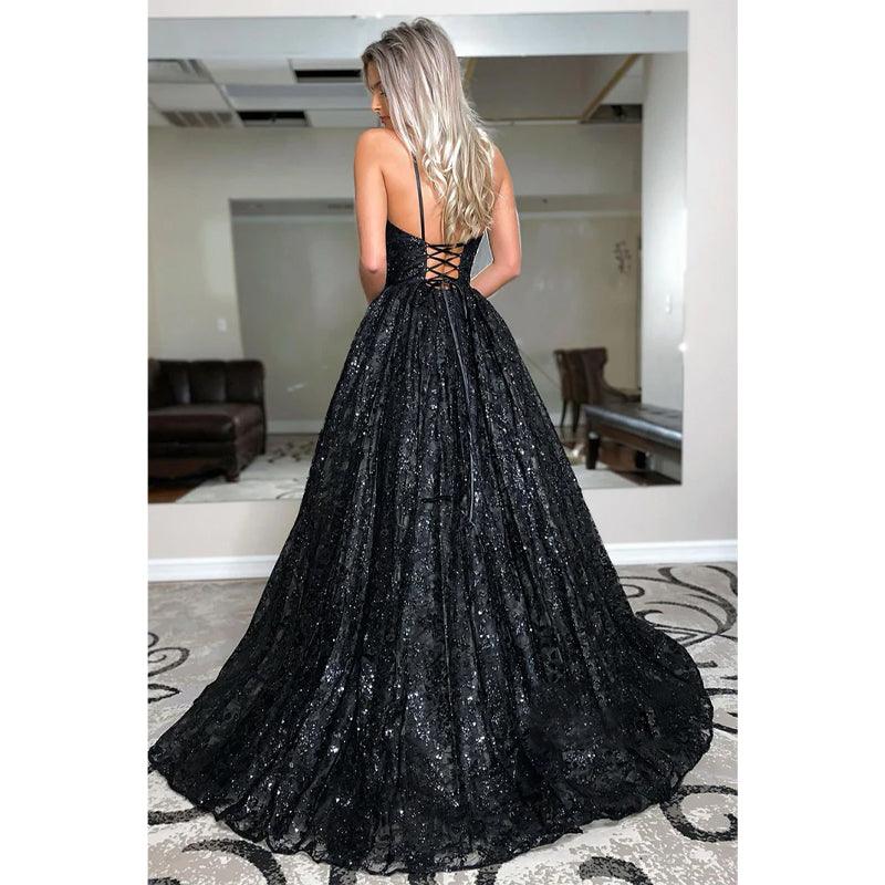 Vestido de fiesta de corte A con escote en V pronunciado y encaje negro con purpurina 