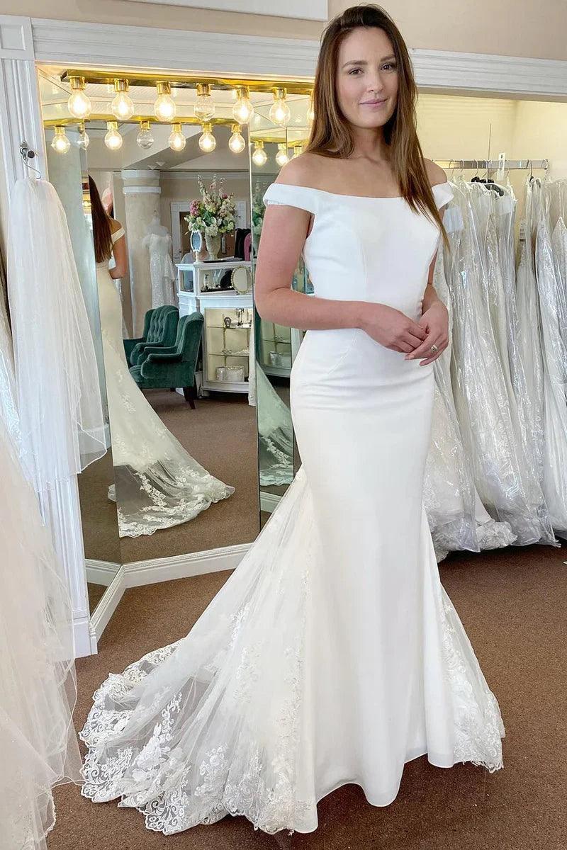 Vestido de novia blanco de corte sirena largo con hombros descubiertos y apliques de encaje