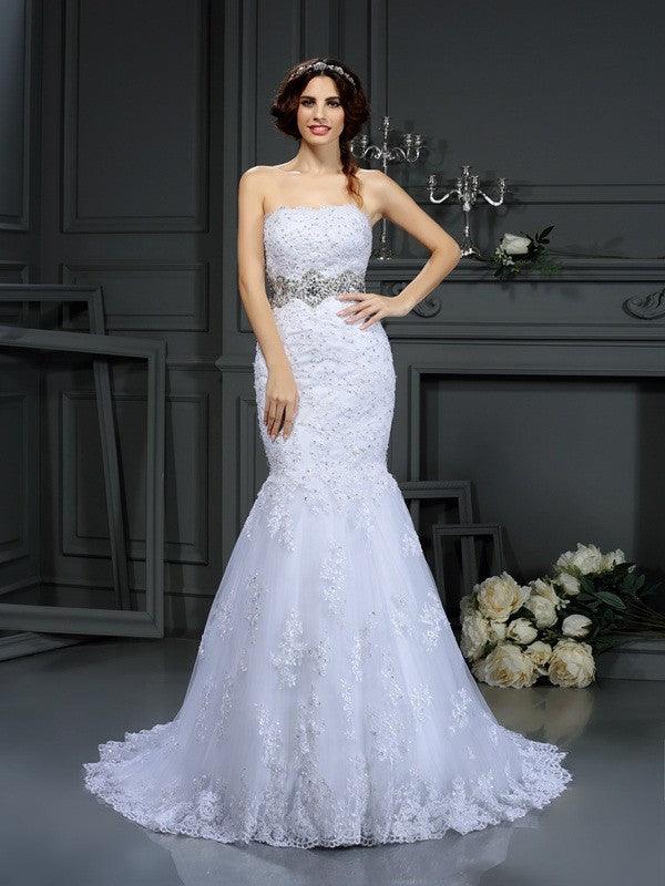 Vestidos de novia largos de encaje sin mangas con cuentas y corte trompeta/sirena