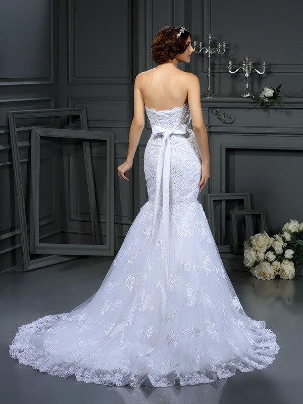 Vestidos de novia largos de encaje sin mangas con cuentas y corte trompeta/sirena