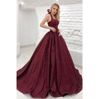 Vestido de fiesta largo burdeos con cuello halter y purpurina 