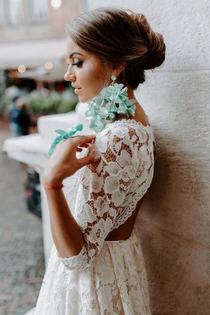 Vestidos de novia de corte A, escote redondo, estilo vintage, de alta calidad, mangas 3/4 y encaje.