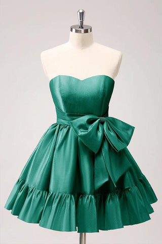 Vestido de fiesta fucsia sin tirantes, con volantes y lazo