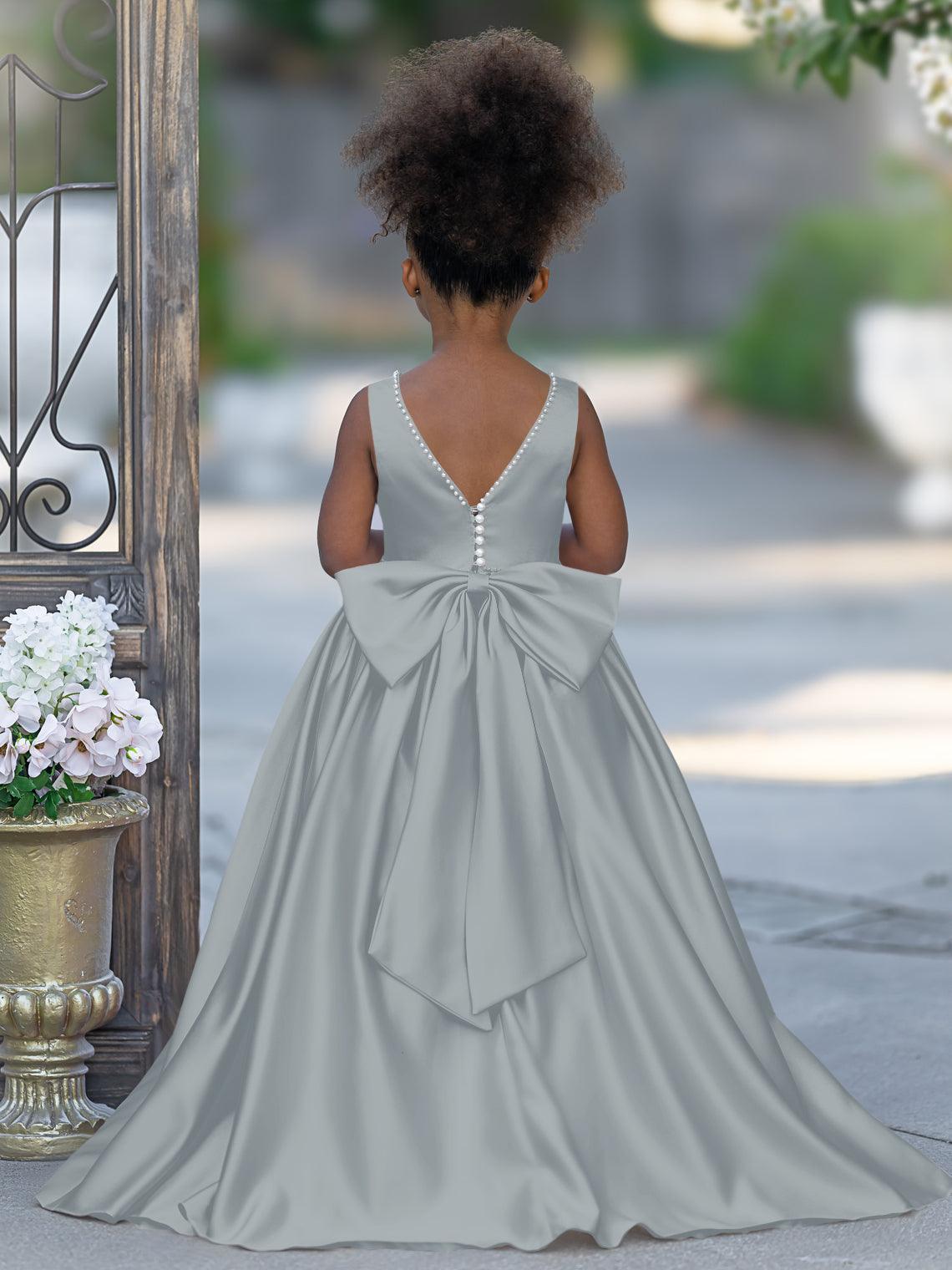 Vestido rosa sin mangas de satén con escote de cuentas y detalle de lazo 
