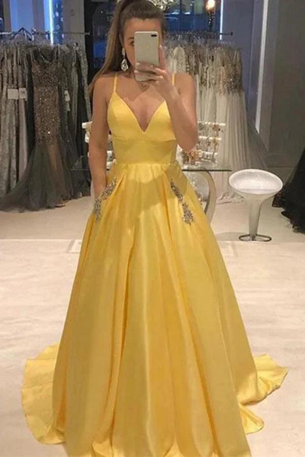 Vestidos de fiesta elegantes con tirantes finos, corte en A, satén, escote en V y bolsillos con cuentas.