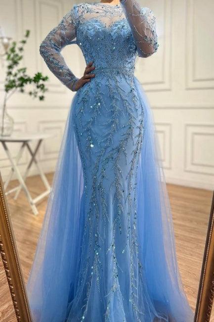 Vestido de fiesta azul océano con apliques, corte sirena, tul, mangas largas, cuentas y escote halter.