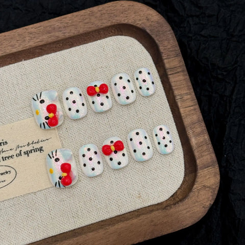 Venta caliente de uñas cortas manuales con lazo de lunares moldeado a mano en 3D 