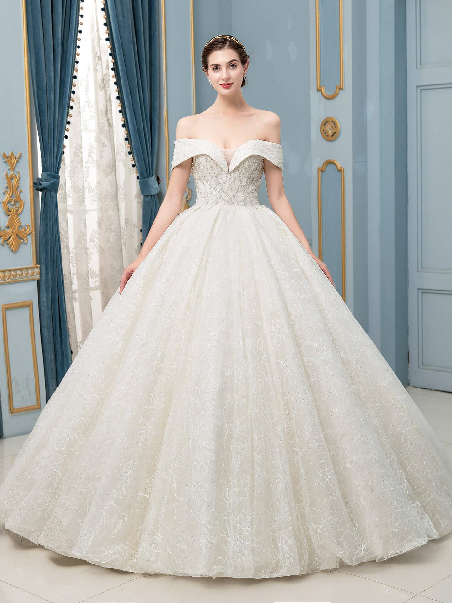 Vestido de novia largo sin mangas con encaje de tul y cuentas hasta el suelo