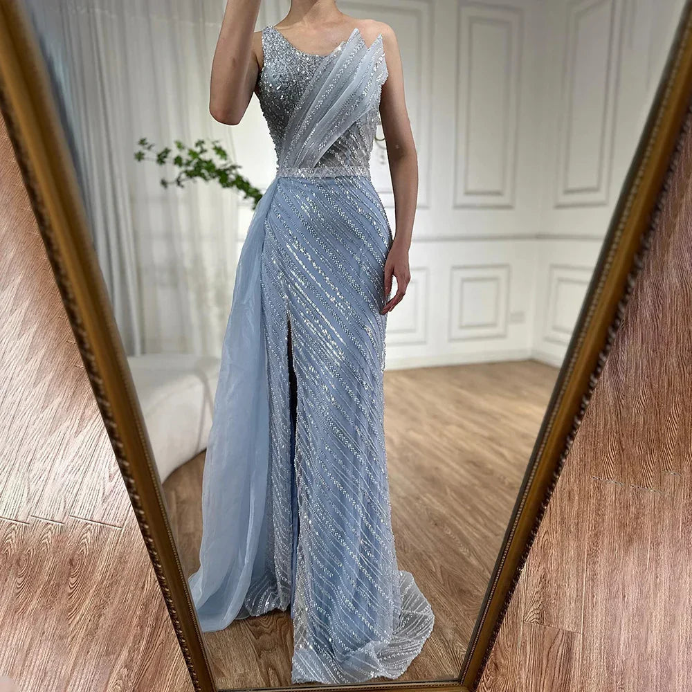 Lujoso vestido de noche saudí azul de Dubái con un solo hombro, abertura y sobrefalda lateral de pedrería para ocasiones formales