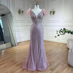Luxuriöses Meerjungfrauen-Abendkleid in Dubai-Blau mit Perlen und Federn