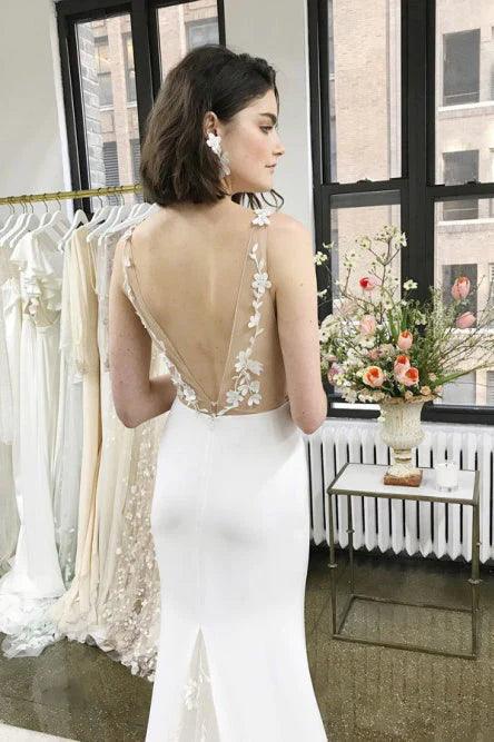 Vestidos de novia de sirena con tirantes de licra y apliques de cola larga