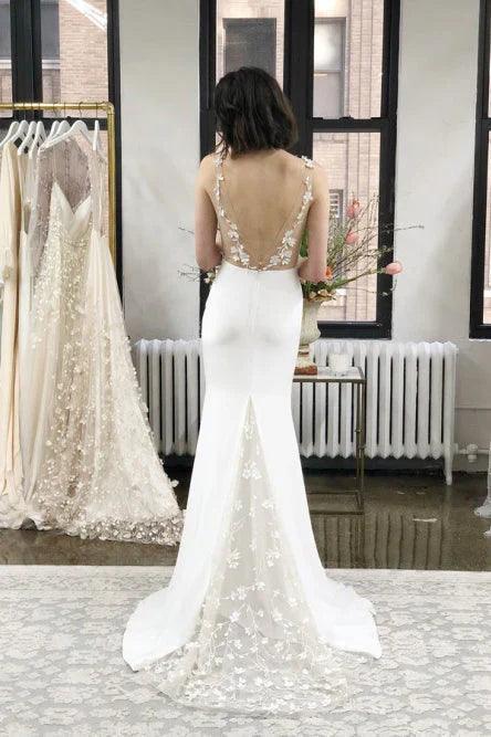 Vestidos de novia de sirena con tirantes de licra y apliques de cola larga