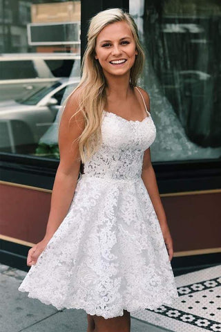 Kurzes, blaues Ballkleid aus Spitze in A-Linie mit Spaghettiträgern und gekreuztem Rücken