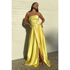 Vestido de fiesta largo de satén amarillo sin tirantes, con abertura alta y bolsillos 