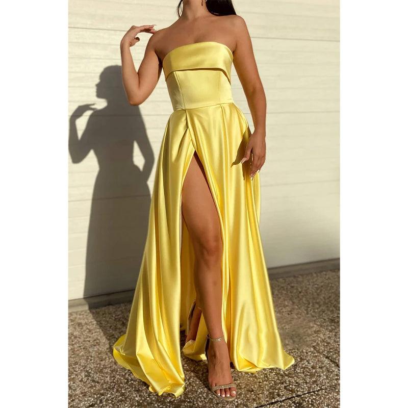 Vestido de fiesta largo de satén amarillo sin tirantes, con abertura alta y bolsillos 