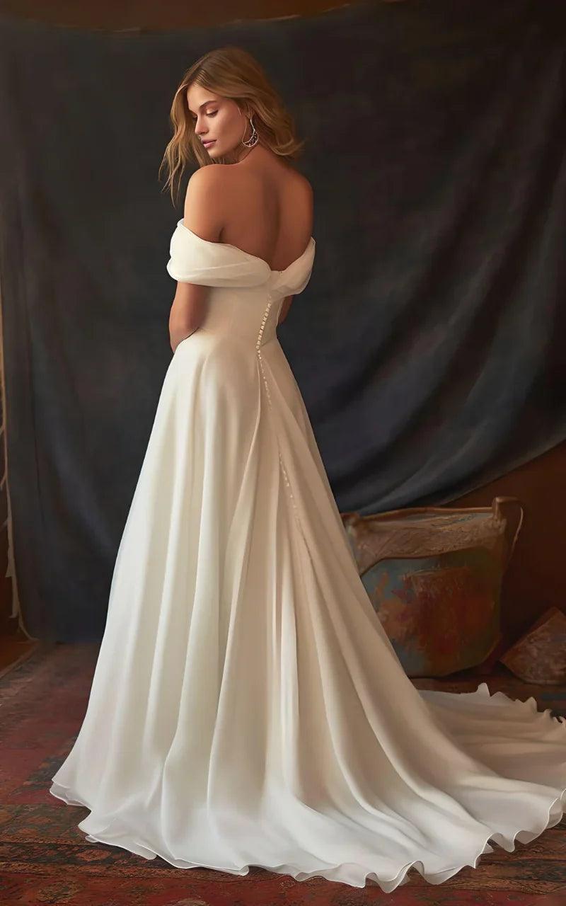 Vestido de novia de corte A de gasa, sin mangas, hombros descubiertos y largo hasta el suelo