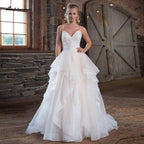 Vestido de novia de organza con tirantes finos y corte princesa de NumberSea