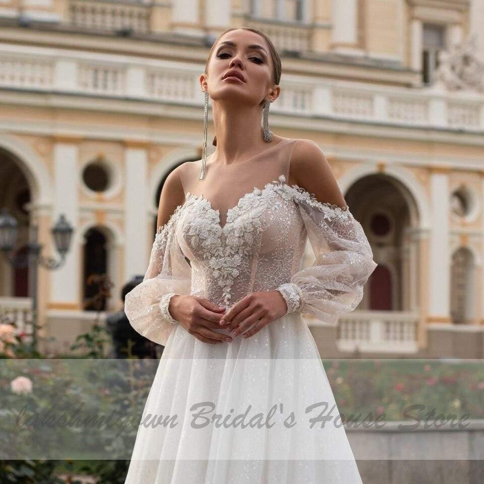 Vestido de novia bohemio estilo princesa NumberSea con mangas abullonadas estilo playero