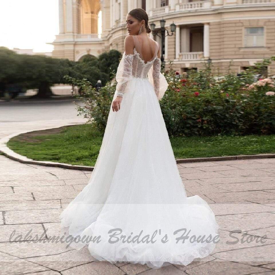 Vestido de novia bohemio estilo princesa NumberSea con mangas abullonadas estilo playero