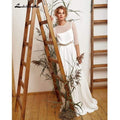 Vestido de novia blanco marfil con mangas abullonadas de NumberSea