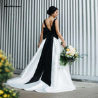 Vestidos de novia de satén blanco y negro con corte de gala de NumberSea