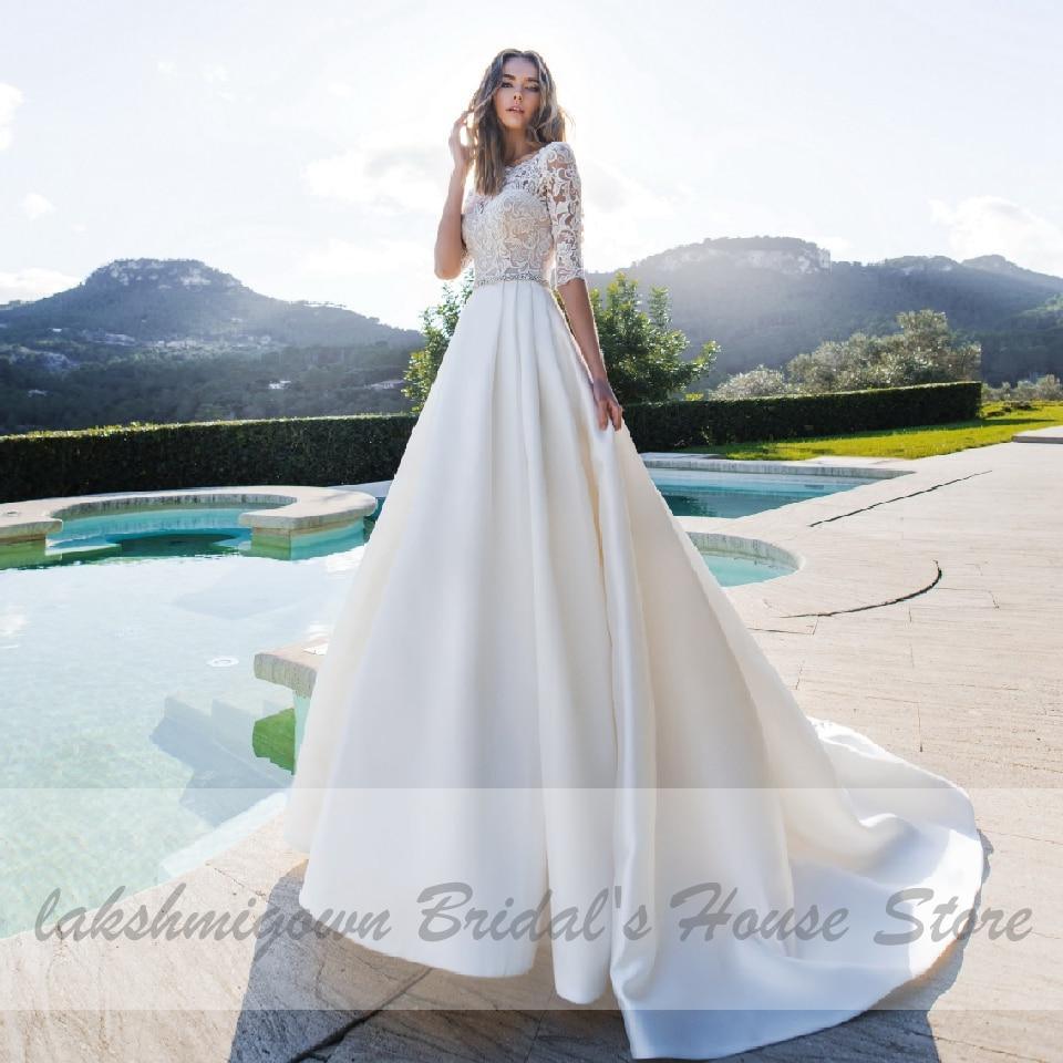 Vestido de novia NumberSea de satén con encaje y media manga, corte A