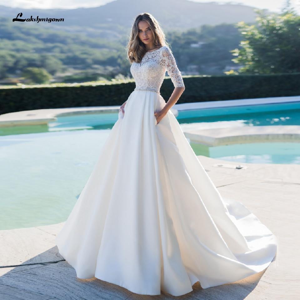 Vestido de novia NumberSea de satén con encaje y media manga, corte A