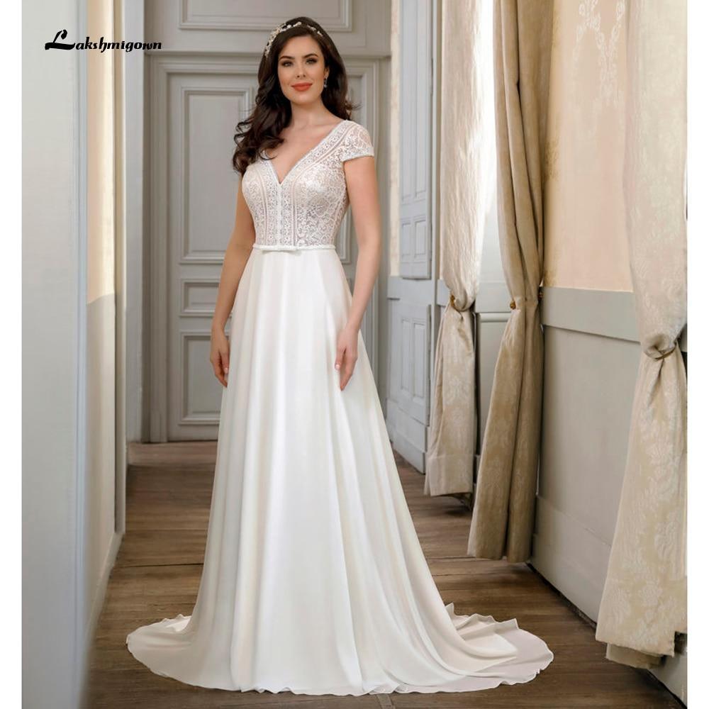 Vestidos de novia NumberSea con escote en V, espalda descubierta y encaje de manga corta