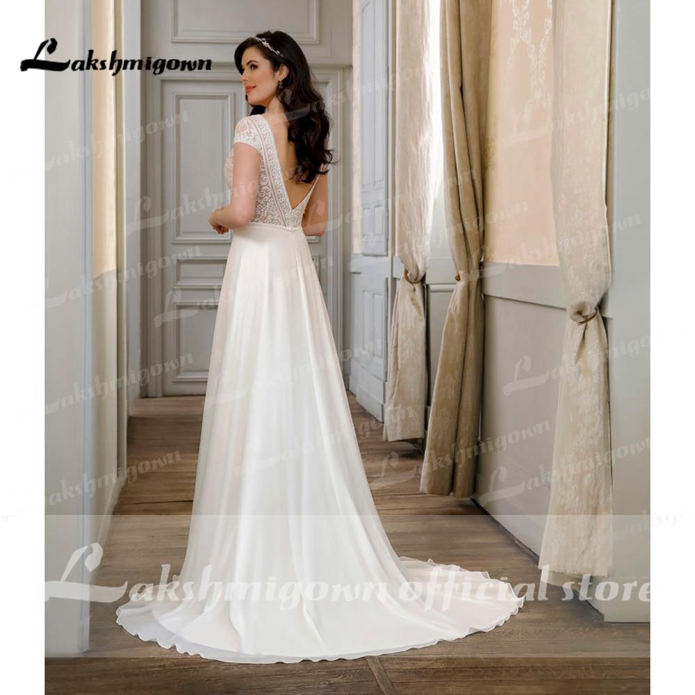 Vestidos de novia NumberSea con escote en V, espalda descubierta y encaje de manga corta