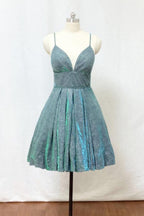 Vestido corto de fiesta con tirantes finos, purpurina verde plateada y bolsillos