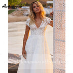 Vestidos de novia NumberSea con escote en V, manga corta, apliques de encaje y espalda abierta