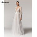 Vestido de novia vintage NumberSea con escote en V profundo color champán, corte A y mangas largas