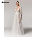 Vestido de novia vintage NumberSea con escote en V profundo color champán, corte A y mangas largas