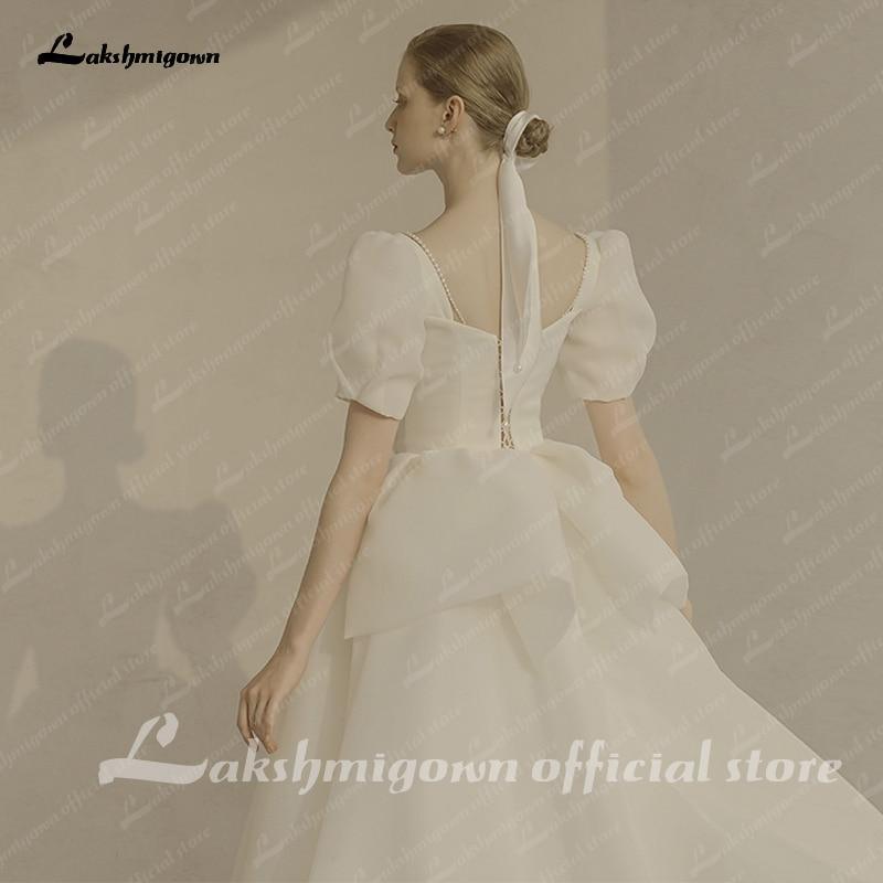 Vestido de novia NumberSea de manga corta abullonada, estilo princesa playero