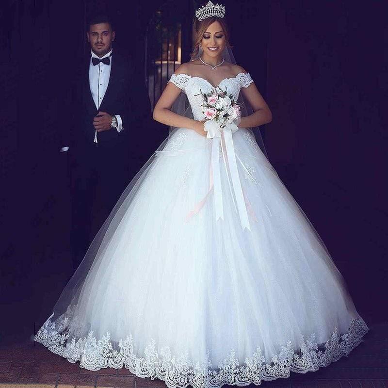 Vestidos de novia NumberSea con cola larga y encaje