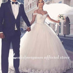 Vestidos de novia NumberSea con cola larga y encaje